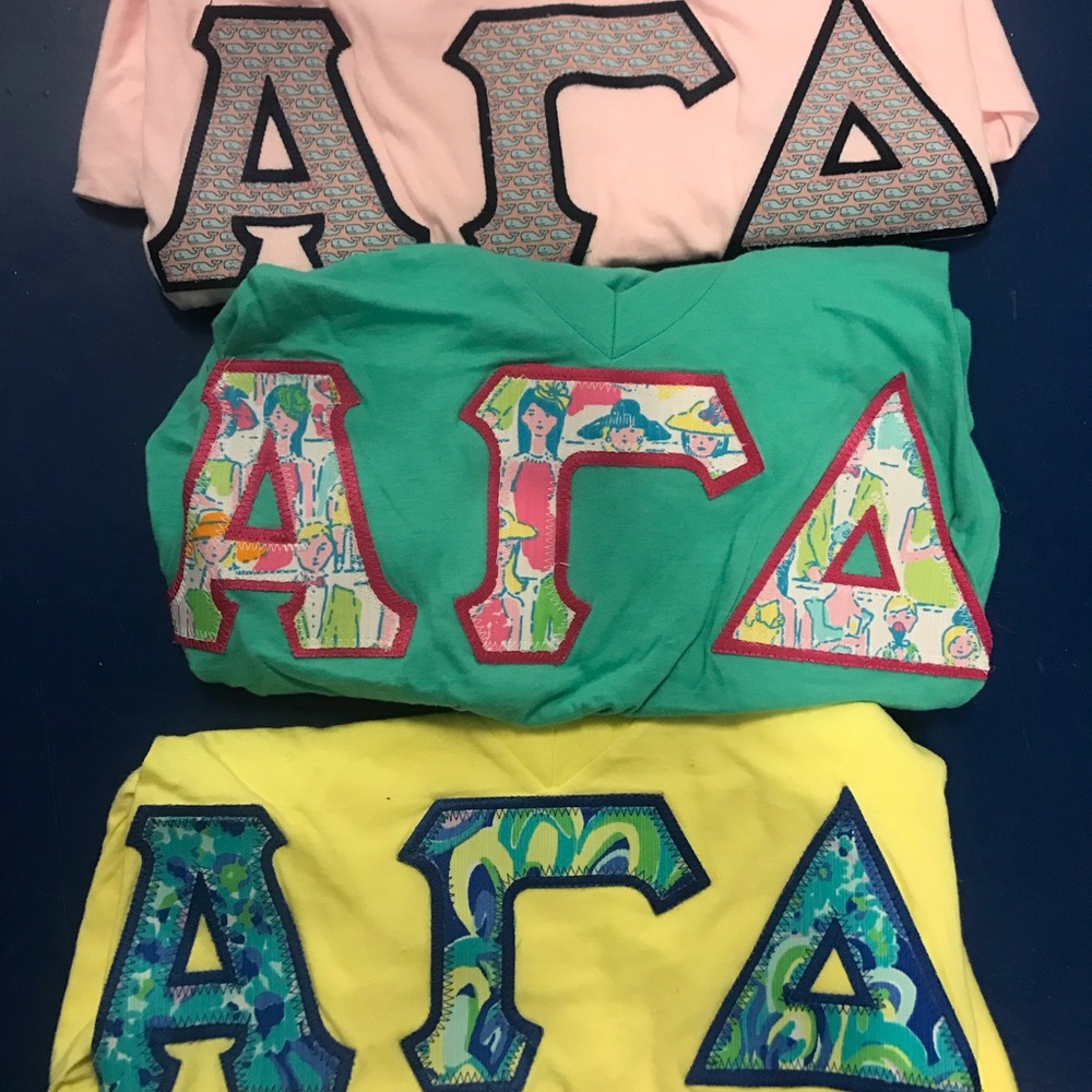 Three Alpha Gamma Delta stitched letter shirts